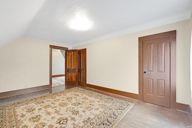 1202 S Van Buren St, Auburn, IN 46706 - bonus room with wood finished floors, vaulted ceiling, and baseboards