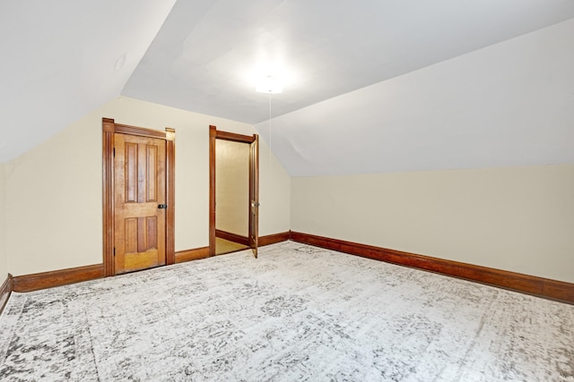 1202 S Van Buren St, Auburn, IN 46706 - bonus room featuring lofted ceiling, baseboards, and carpet flooring
