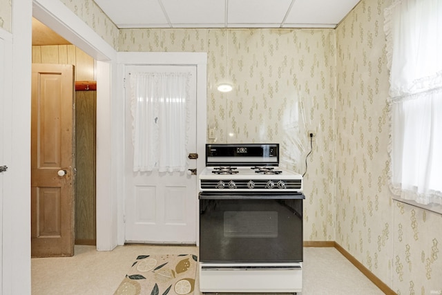 1202 S Van Buren St, Auburn, IN 46706 - kitchen featuring range with gas stovetop and wallpapered walls