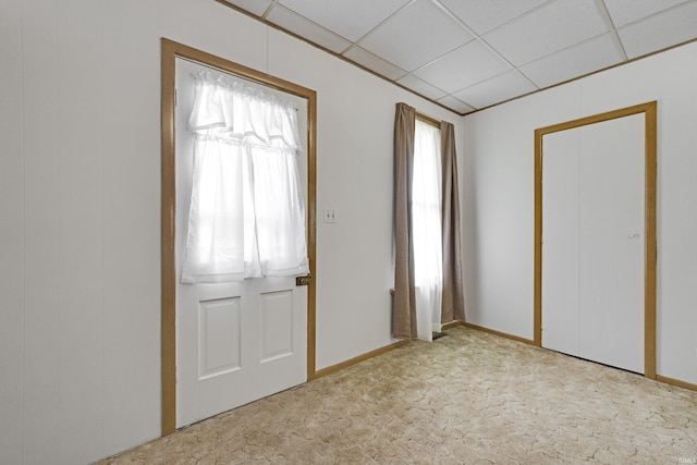 1202 S Van Buren St, Auburn, IN 46706 - entryway with carpet, baseboards, and a paneled ceiling
