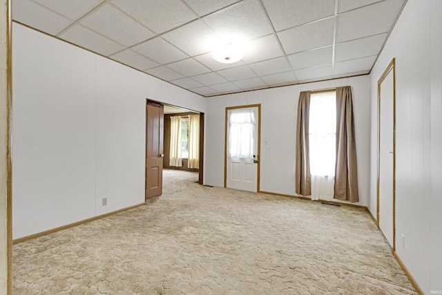 1202 S Van Buren St, Auburn, IN 46706 - spare room featuring a paneled ceiling, light carpet, and baseboards