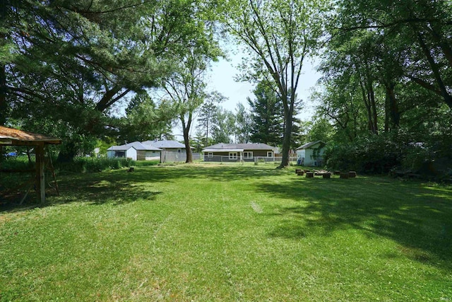 52589 Lilac Rd, South Bend, IN 46628 - view of yard featuring a garage