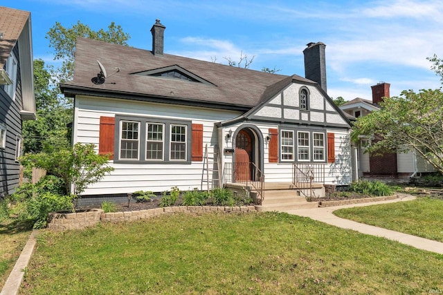 3709 Shady Ct, Fort Wayne, IN 46807 - tudor house featuring a front yard and a chimney
