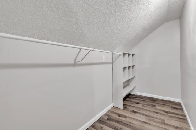 3709 Shady Ct, Fort Wayne, IN 46807 - spacious closet featuring vaulted ceiling and wood finished floors