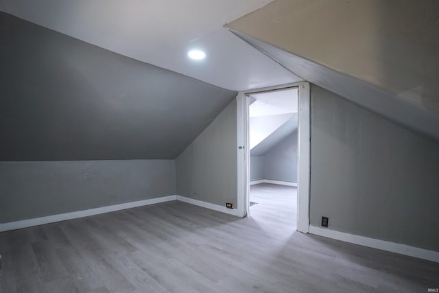 2117 Linden Ave, South Bend, IN 46628 - bonus room featuring wood finished floors, vaulted ceiling, baseboards, and recessed lighting