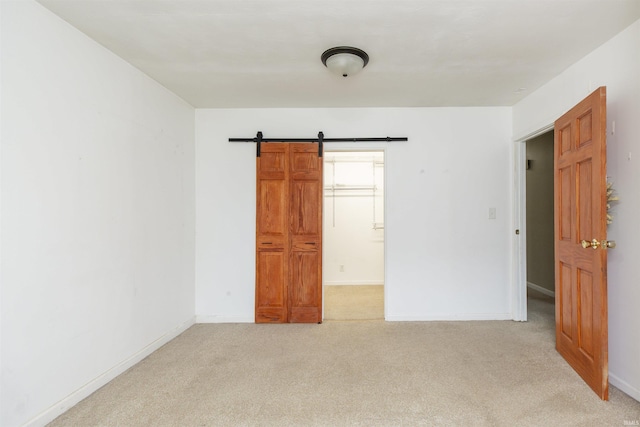 53140 Bowercrest Ct, South Bend, IN 46635 - empty room featuring light colored carpet, baseboards, and a barn door