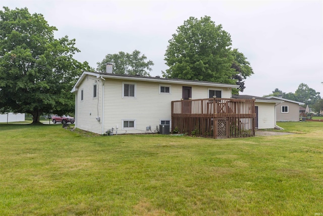 53140 Bowercrest Ct, South Bend, IN 46635 - rear view of property with a wooden deck, a lawn, a chimney, and central AC