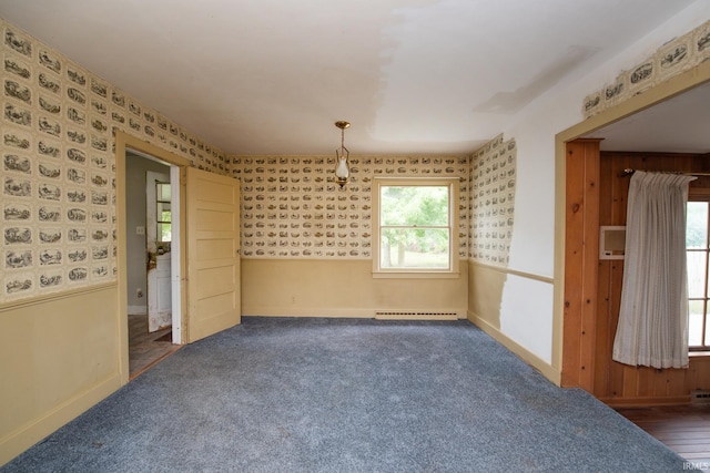 924 S Washington St, Delphi, IN 46923 - unfurnished dining area with a baseboard radiator, wallpapered walls, baseboards, and dark carpet