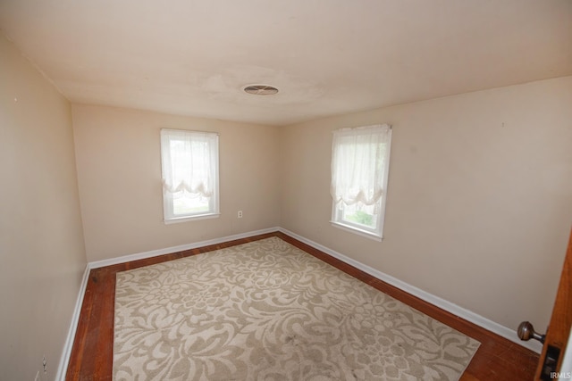 924 S Washington St, Delphi, IN 46923 - empty room featuring healthy amount of natural light, wood finished floors, and baseboards