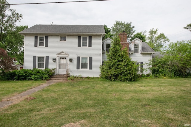 924 S Washington St, Delphi, IN 46923 - colonial inspired home featuring a front yard and a chimney