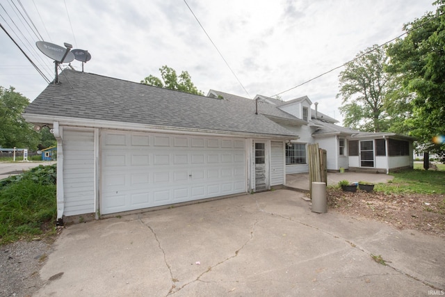 924 S Washington St, Delphi, IN 46923 - view of front of home featuring a shingled roof and a sunroom