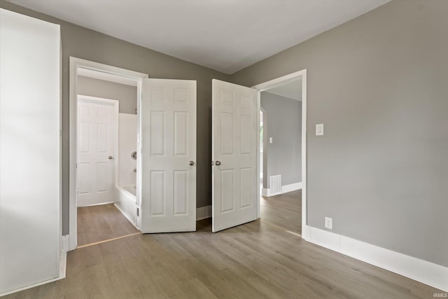 1815 E Bowman St, South Bend, IN 46613 - unfurnished bedroom featuring wood finished floors and baseboards