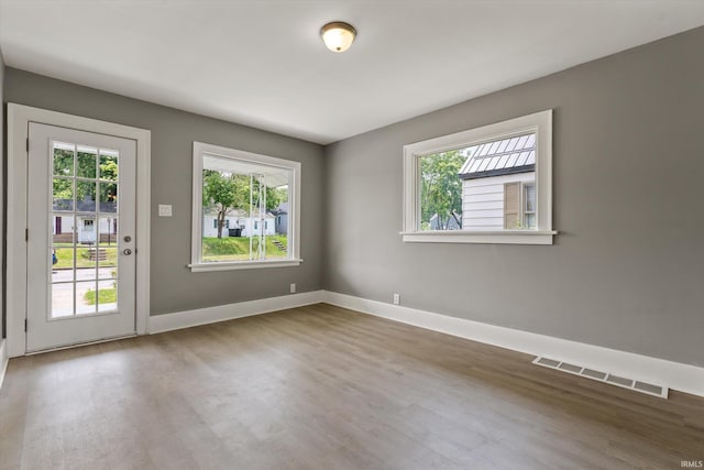 1815 E Bowman St, South Bend, IN 46613 - unfurnished room with plenty of natural light, wood finished floors, and baseboards