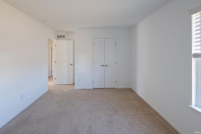 4632 Portney Pl, Fort Wayne, IN 46818 - unfurnished bedroom featuring light carpet, baseboards, and a closet