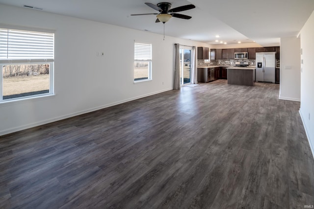 4632 Portney Pl, Fort Wayne, IN 46818 - unfurnished living room featuring ceiling fan, dark wood-style floors, baseboards, and recessed lighting
