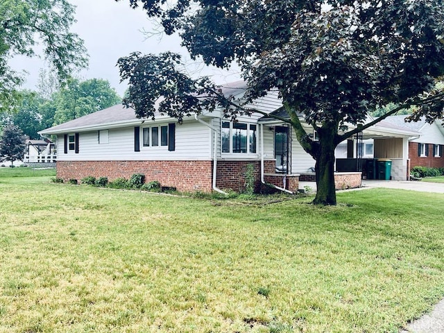 121 N Oakley Ave, Mishawaka, IN 46544 - view of front of house with a front lawn and brick siding
