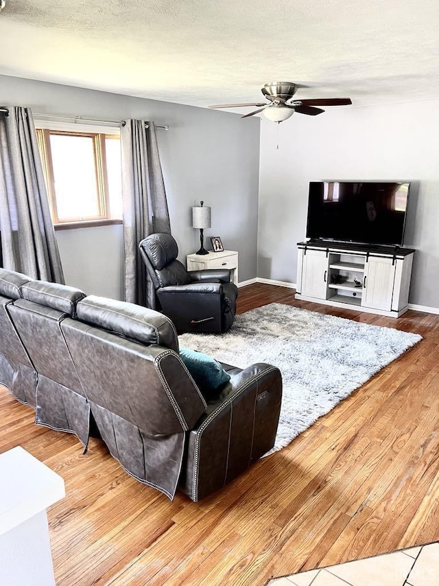 121 N Oakley Ave, Mishawaka, IN 46544 - living room featuring ceiling fan, wood finished floors, and baseboards