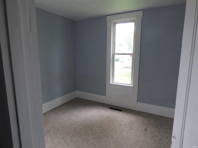 302 W Freeman St, Frankfort, IN 46041 - carpeted empty room featuring baseboards
