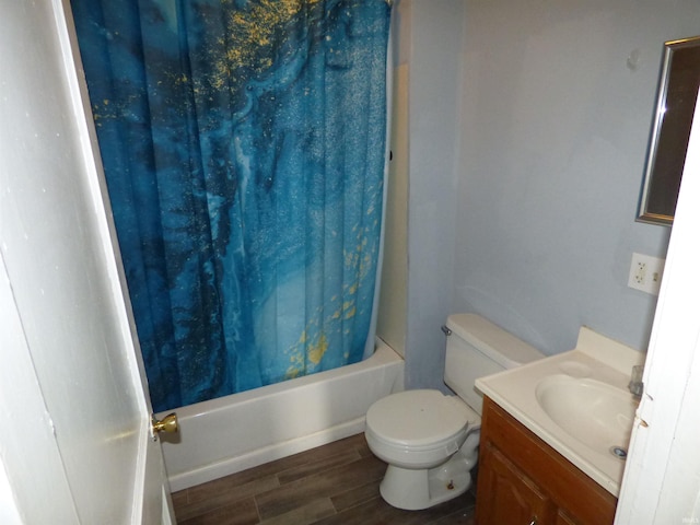 302 W Freeman St, Frankfort, IN 46041 - full bath featuring wood finished floors, vanity, shower / bath combination with curtain, and toilet