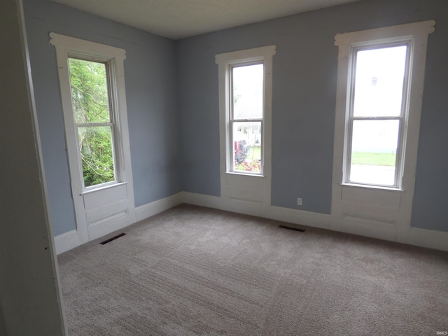 302 W Freeman St, Frankfort, IN 46041 - carpeted spare room with healthy amount of natural light and baseboards