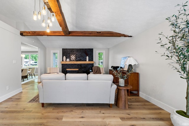 5012 Autumn Ln, Lafayette, IN 47909 - living room featuring baseboards, a fireplace, and light wood-style floors