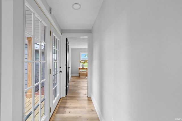 5012 Autumn Ln, Lafayette, IN 47909 - corridor featuring light wood-type flooring, french doors, and baseboards