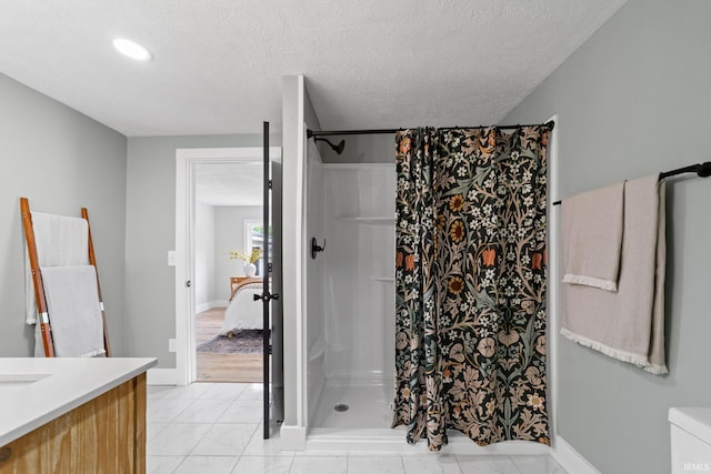 5012 Autumn Ln, Lafayette, IN 47909 - bathroom featuring a shower with curtain, vanity, a textured ceiling, baseboards, and recessed lighting