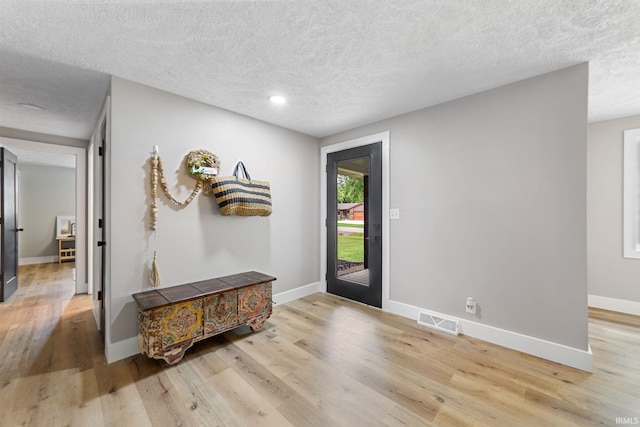 5012 Autumn Ln, Lafayette, IN 47909 - foyer featuring wood finished floors, a textured ceiling, baseboards, and recessed lighting