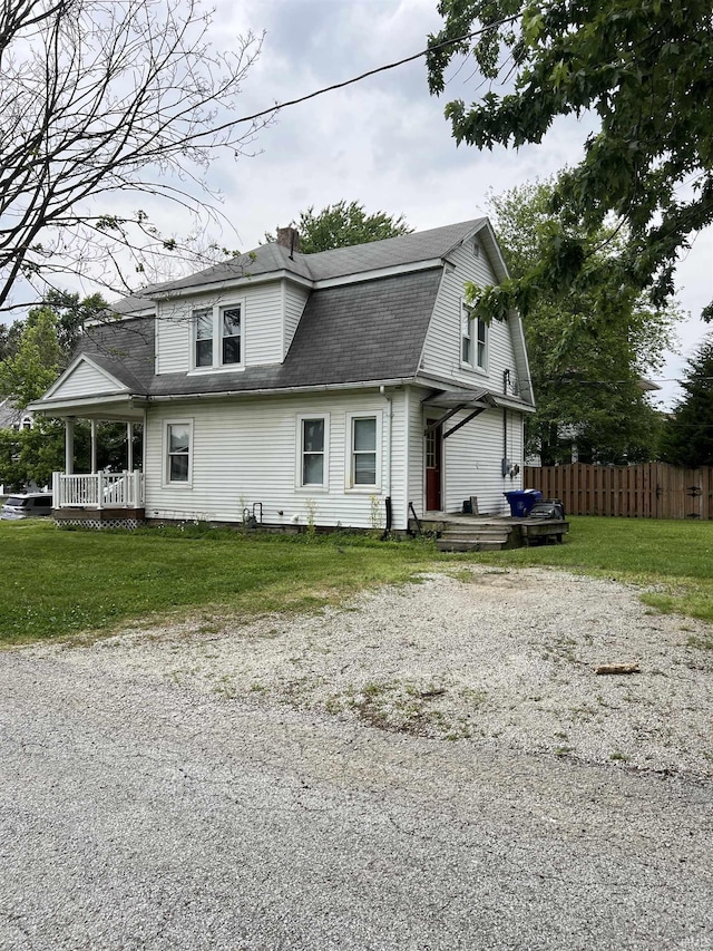 1118 N Webster St, Kokomo, IN 46901 - view of side of home with a gambrel roof, a shingled roof, and a chimney