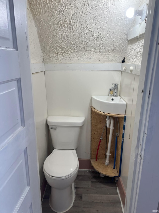 1118 N Webster St, Kokomo, IN 46901 - bathroom with toilet, wood finished floors, and a sink