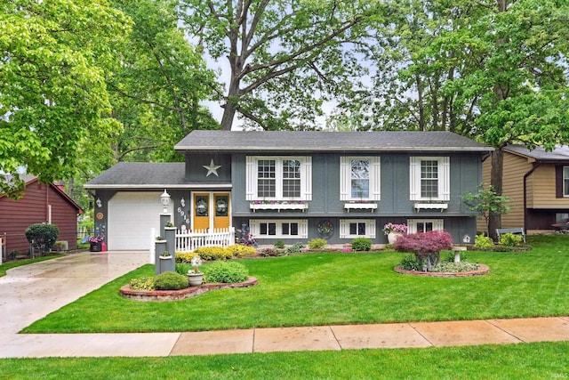 6916 Woodtrail Ct, Fort Wayne, IN 46835 - split level home with a garage, concrete driveway, and a front lawn