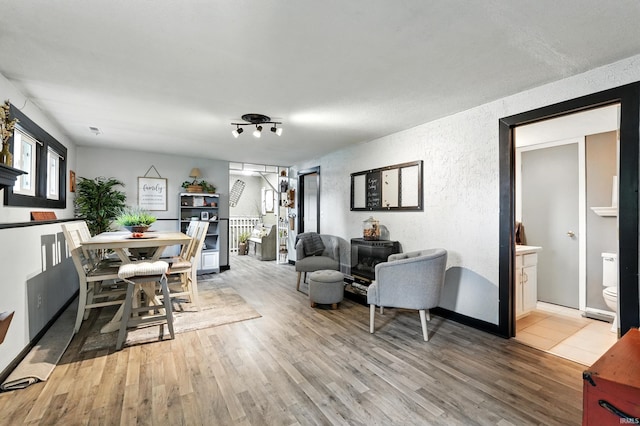 6916 Woodtrail Ct, Fort Wayne, IN 46835 - living area featuring light wood-type flooring and a textured wall