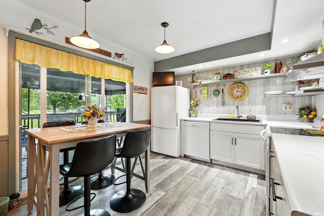 6916 Woodtrail Ct, Fort Wayne, IN 46835 - kitchen with white appliances, a sink, light wood-type flooring, open shelves, and light countertops