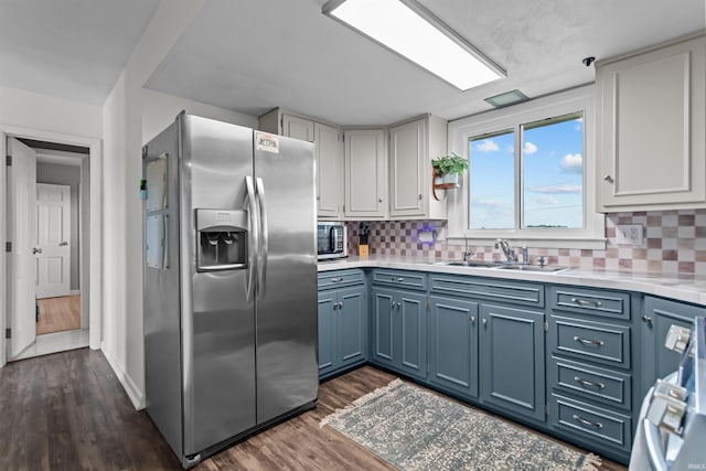 5345 E 00 Ns, Greentown, IN 46936 - kitchen with stainless steel appliances, a sink, light countertops, and blue cabinetry