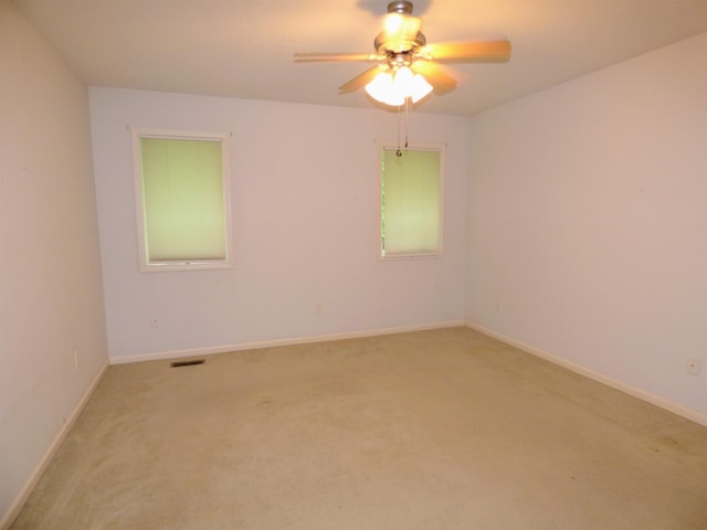 8202 Red Shank Ln, Fort Wayne, IN 46825 - unfurnished room with a ceiling fan, light colored carpet, and baseboards