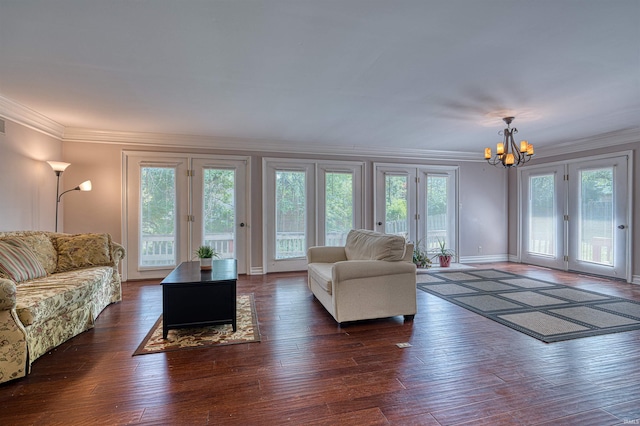 505 Wyndclyff Dr, Evansville, IN 47711 - living area with a chandelier, french doors, ornamental molding, dark wood finished floors, and baseboards
