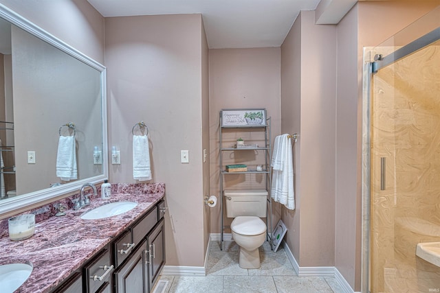 505 Wyndclyff Dr, Evansville, IN 47711 - full bath with double vanity, toilet, baseboards, tile patterned flooring, and an enclosed shower