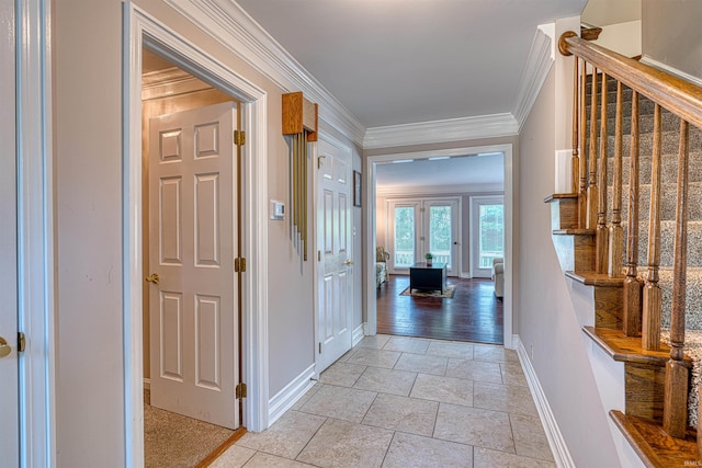 505 Wyndclyff Dr, Evansville, IN 47711 - corridor featuring stairway, baseboards, crown molding, and stone tile floors