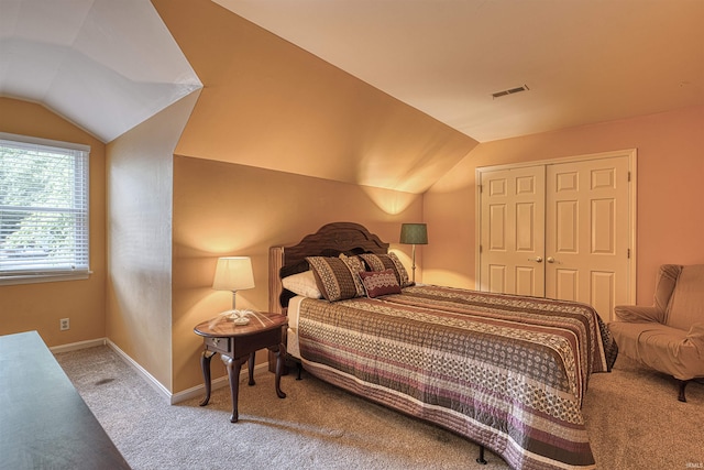 505 Wyndclyff Dr, Evansville, IN 47711 - carpeted bedroom with vaulted ceiling, a closet, and baseboards