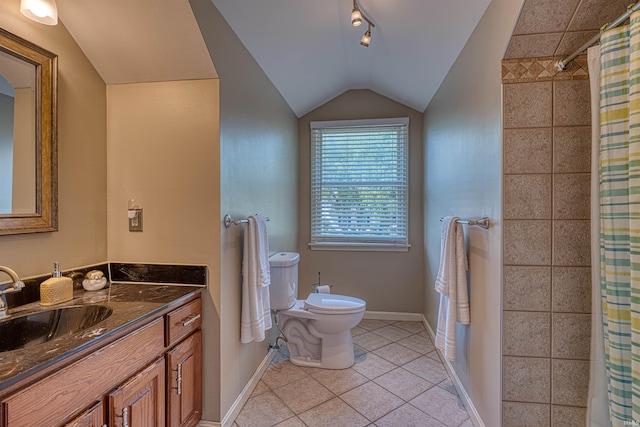 505 Wyndclyff Dr, Evansville, IN 47711 - full bath with vanity, toilet, tile patterned flooring, lofted ceiling, and baseboards
