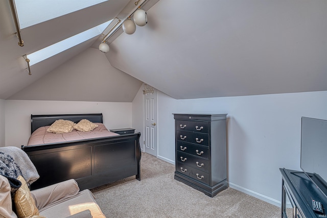 505 Wyndclyff Dr, Evansville, IN 47711 - carpeted bedroom with vaulted ceiling, baseboards, and track lighting