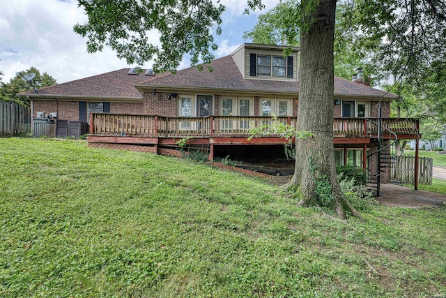505 Wyndclyff Dr, Evansville, IN 47711 - rear view of property with a wooden deck, stairs, brick siding, and roof with shingles
