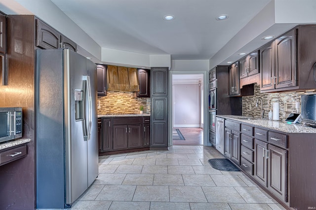 505 Wyndclyff Dr, Evansville, IN 47711 - kitchen featuring stainless steel appliances, a sink, backsplash, recessed lighting, and dark brown cabinetry