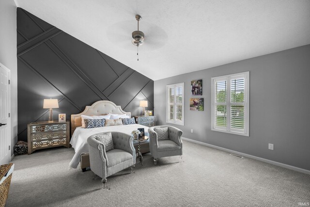 14609 Carrigan Ct, Granger, IN 46530 - bedroom featuring carpet floors, baseboards, a ceiling fan, and a decorative wall