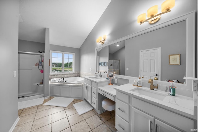 14609 Carrigan Ct, Granger, IN 46530 - bathroom with double vanity, a shower stall, a bath, lofted ceiling, and tile patterned floors