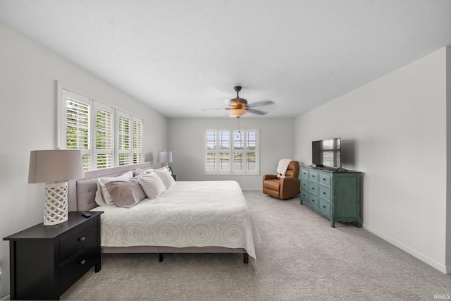 14609 Carrigan Ct, Granger, IN 46530 - bedroom with light colored carpet, ceiling fan, and baseboards