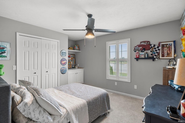14609 Carrigan Ct, Granger, IN 46530 - bedroom with a closet, carpet, baseboards, and a ceiling fan