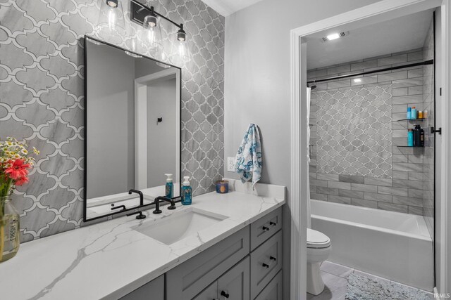 14609 Carrigan Ct, Granger, IN 46530 - full bathroom featuring vanity, toilet, and bathtub / shower combination