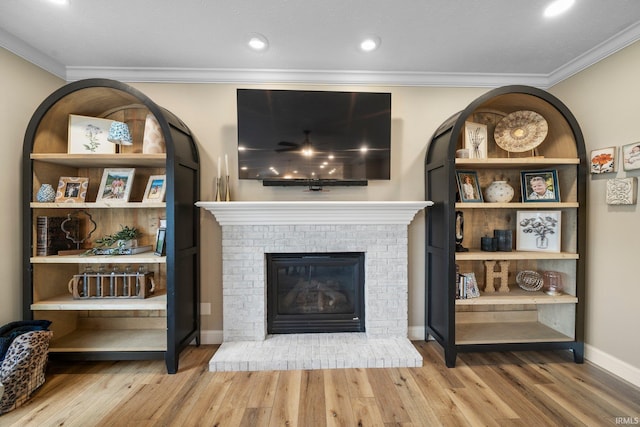 14609 Carrigan Ct, Granger, IN 46530 - living area with a fireplace, crown molding, wood finished floors, and baseboards