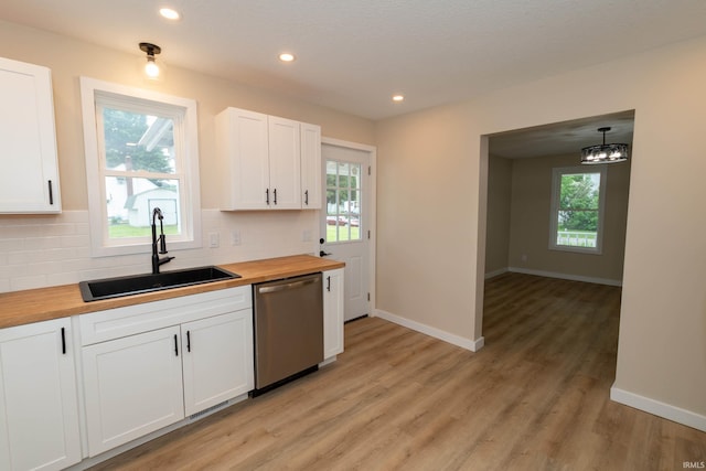 400 E Center St, North Liberty, IN 46554 - kitchen featuring butcher block counters, dishwasher, a sink, decorative backsplash, and recessed lighting